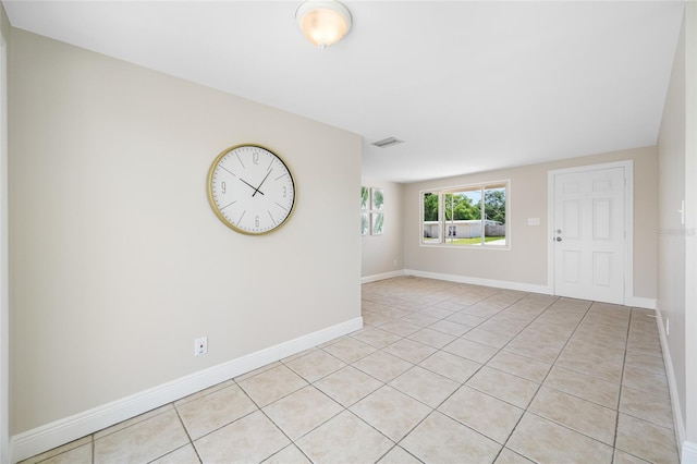 10599 111th Ave N, Largo, FL 33773 - empty room with light tile patterned flooring and baseboards