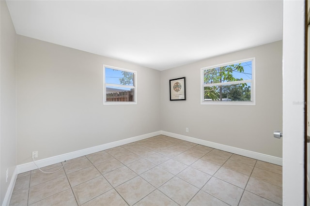 10599 111th Ave N, Largo, FL 33773 - unfurnished room with light tile patterned floors and baseboards