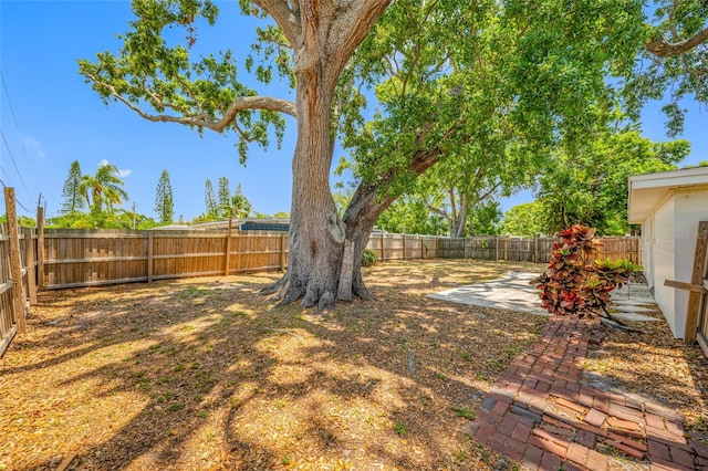 10599 111th Ave N, Largo, FL 33773 - fenced backyard featuring a patio