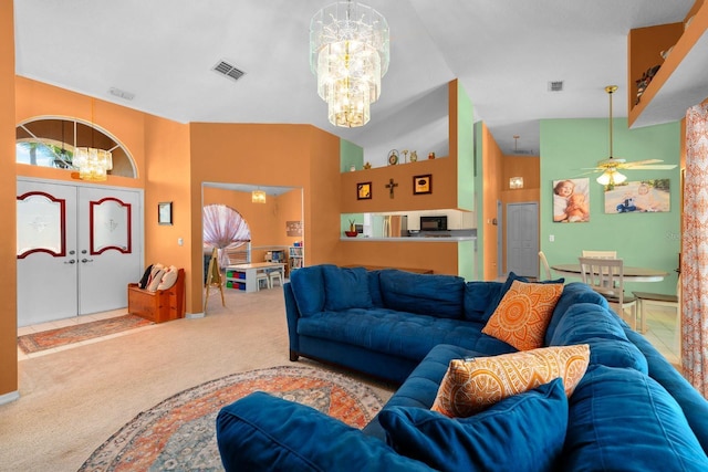10228 Yellow Pine Way, Hudson, FL 34667 - carpeted living area featuring a chandelier, a towering ceiling, and a ceiling fan