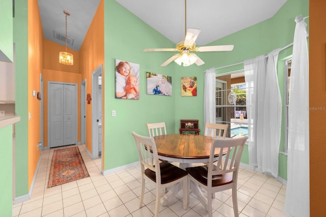 10228 Yellow Pine Way, Hudson, FL 34667 - dining area featuring light tile patterned floors, high vaulted ceiling, a ceiling fan, a chandelier, and baseboards