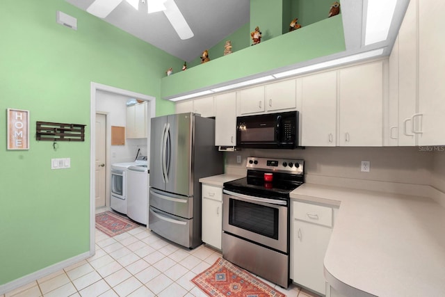 10228 Yellow Pine Way, Hudson, FL 34667 - kitchen with stainless steel appliances, separate washer and dryer, light countertops, ceiling fan, and white cabinetry
