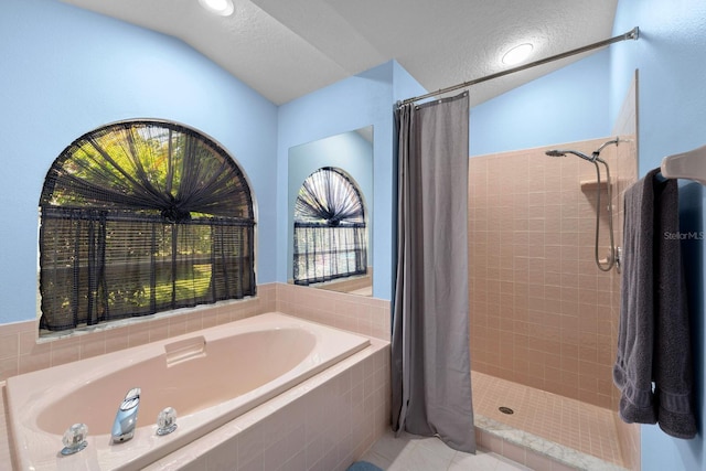 10228 Yellow Pine Way, Hudson, FL 34667 - full bath featuring a garden tub, a shower stall, and tile patterned floors
