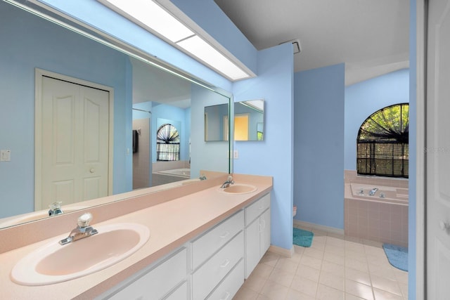 10228 Yellow Pine Way, Hudson, FL 34667 - full bathroom with a garden tub, baseboards, double vanity, tile patterned flooring, and toilet
