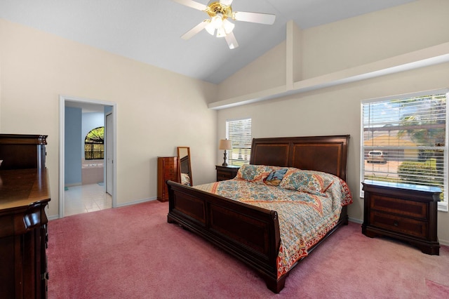 10228 Yellow Pine Way, Hudson, FL 34667 - bedroom featuring light carpet, multiple windows, baseboards, high vaulted ceiling, and connected bathroom