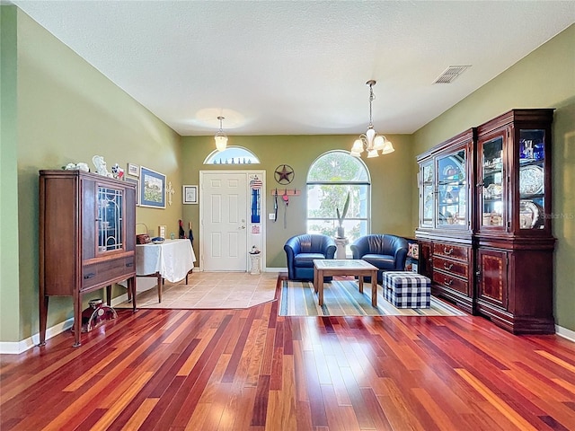 4315 Whittner Dr, Land O Lakes, FL 34639 - entrance foyer featuring hardwood / wood-style floors and a chandelier