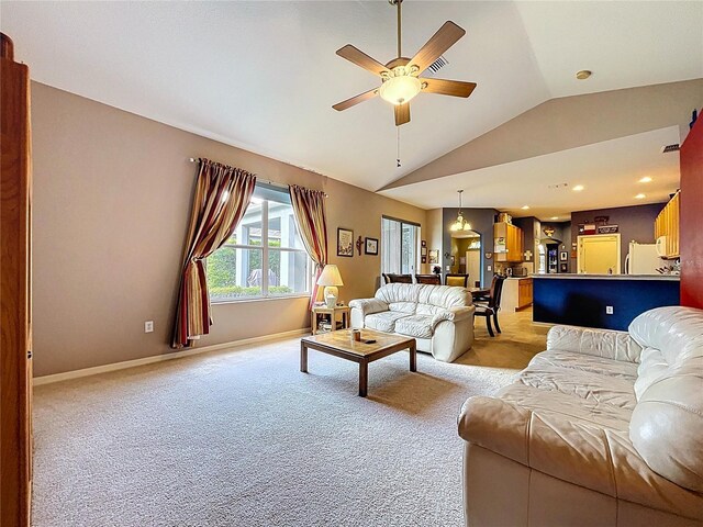 4315 Whittner Dr, Land O Lakes, FL 34639 - living area with vaulted ceiling, light carpet, and ceiling fan