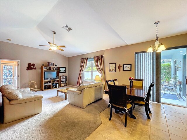 4315 Whittner Dr, Land O Lakes, FL 34639 - living area with lofted ceiling, a chandelier, ceiling fan, and light tile patterned floors