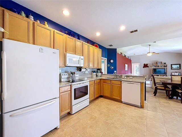 4315 Whittner Dr, Land O Lakes, FL 34639 - kitchen featuring white appliances, a peninsula, light tile patterned floors, light countertops, and recessed lighting