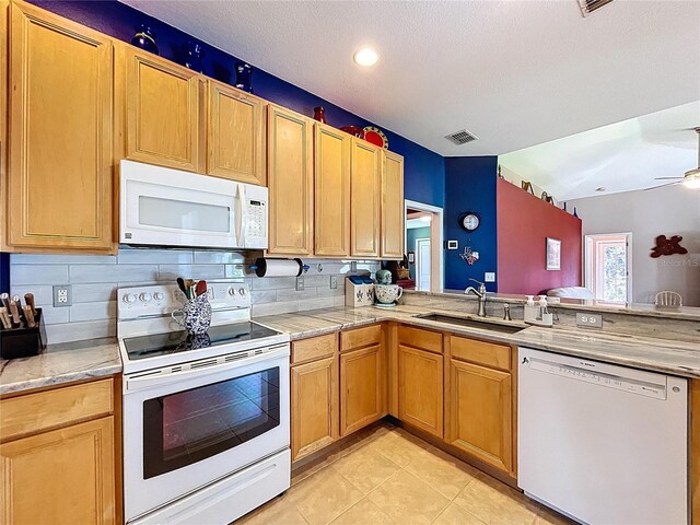 4315 Whittner Dr, Land O Lakes, FL 34639 - kitchen with white appliances, light countertops, tasteful backsplash, light tile patterned flooring, and recessed lighting