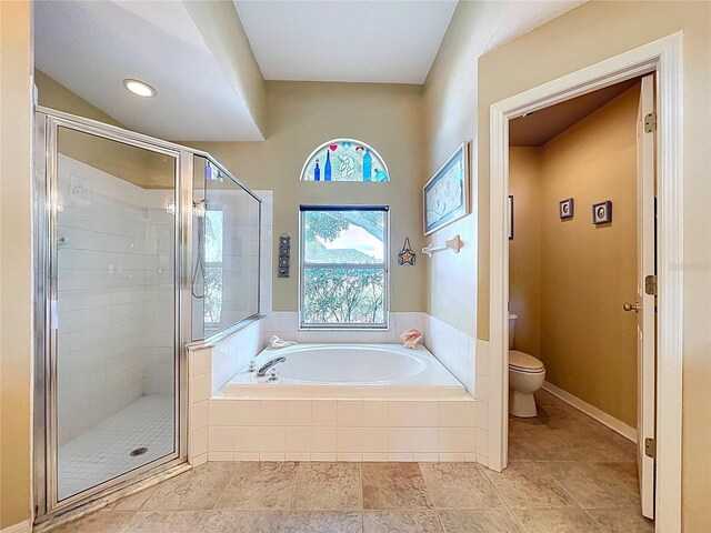 4315 Whittner Dr, Land O Lakes, FL 34639 - bathroom with a garden tub, a stall shower, and tile patterned flooring