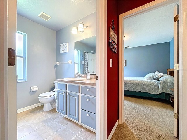 4315 Whittner Dr, Land O Lakes, FL 34639 - ensuite bathroom featuring vanity, a shower, and tile patterned floors