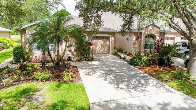 5143 Lochmead Ter, Zephyrhills, FL 33541 - view of front of home featuring concrete driveway and stucco siding