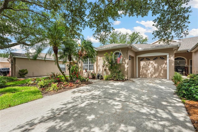 5143 Lochmead Ter, Zephyrhills, FL 33541 - ranch-style house with stucco siding, concrete driveway, and a garage