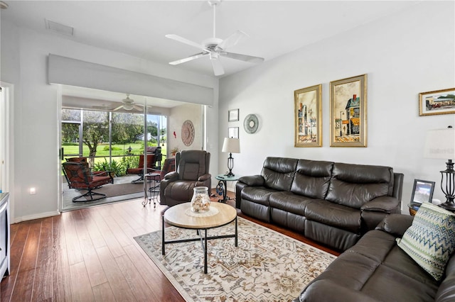 5143 Lochmead Ter, Zephyrhills, FL 33541 - living area with a ceiling fan, dark wood-type flooring, and baseboards