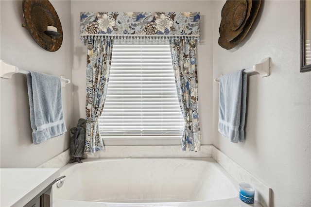5143 Lochmead Ter, Zephyrhills, FL 33541 - bathroom with a garden tub and vanity