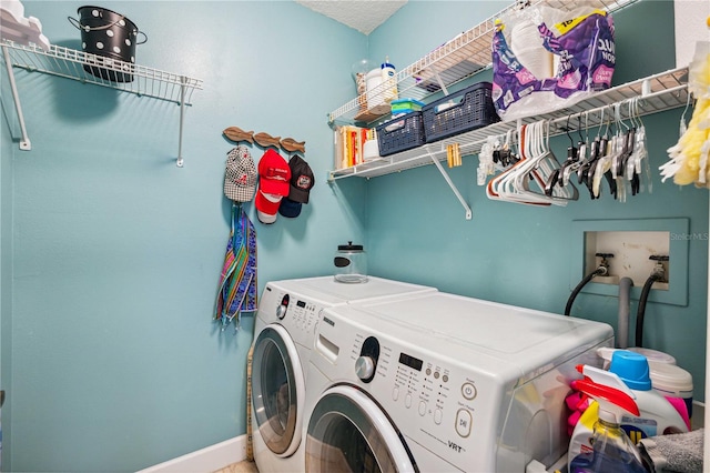5143 Lochmead Ter, Zephyrhills, FL 33541 - washroom with washing machine and clothes dryer and baseboards