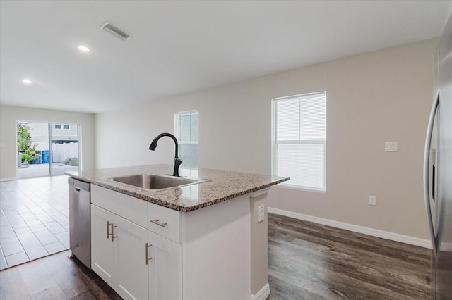 13016 Boggy Creek Dr, Riverview, FL 33579 - kitchen featuring a sink, appliances with stainless steel finishes, dark wood finished floors, light stone counters, and recessed lighting