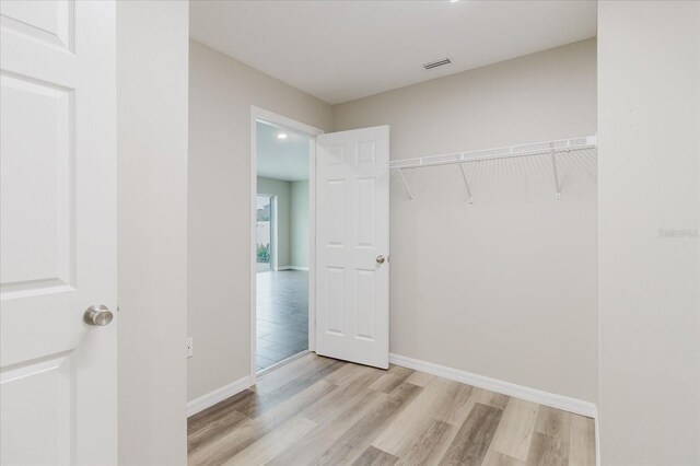 13016 Boggy Creek Dr, Riverview, FL 33579 - walk in closet featuring light wood finished floors