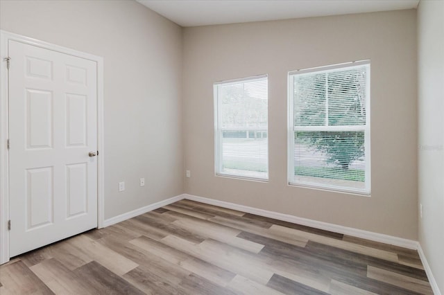 13016 Boggy Creek Dr, Riverview, FL 33579 - unfurnished room with wood finished floors and baseboards