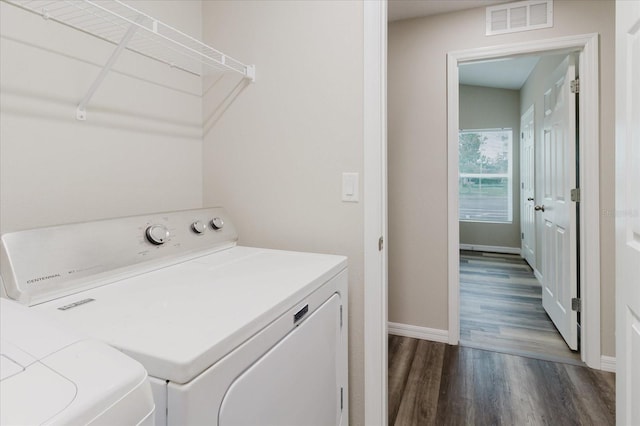 13016 Boggy Creek Dr, Riverview, FL 33579 - laundry room featuring washer and dryer, dark wood finished floors, and baseboards