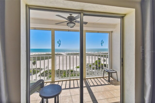 11000 Gulf Blvd Unit 703, Treasure Island, FL 33706 - balcony with view of water and beach and a ceiling fan