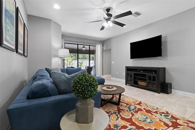 12729 Flatwood Creek Dr, Gibsonton, FL 33534 - living area featuring a ceiling fan, baseboards, and light marble finish floors