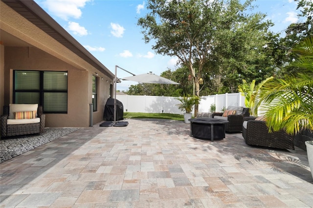12729 Flatwood Creek Dr, Gibsonton, FL 33534 - fenced backyard featuring a fire pit, a patio area, and a grill