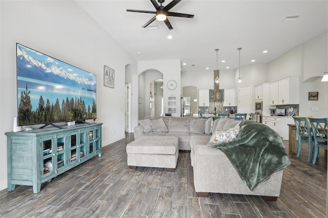 808 Vittorio Pl, Brandon, FL 33511 - living room with a ceiling fan, arched walkways, dark wood finished floors, baseboards, and recessed lighting