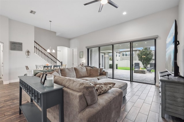808 Vittorio Pl, Brandon, FL 33511 - living room featuring stairway, a ceiling fan, wood finished floors, arched walkways, and recessed lighting