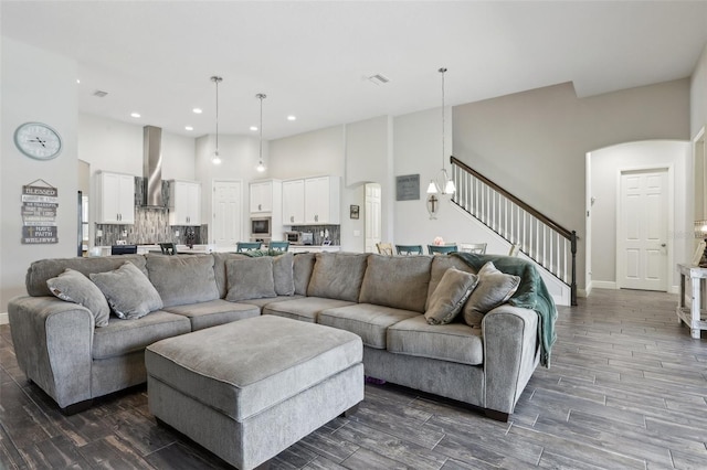 808 Vittorio Pl, Brandon, FL 33511 - living area with a towering ceiling, stairs, dark wood finished floors, recessed lighting, and baseboards