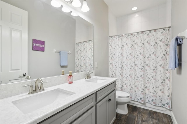 808 Vittorio Pl, Brandon, FL 33511 - bathroom featuring toilet, double vanity, and wood finished floors
