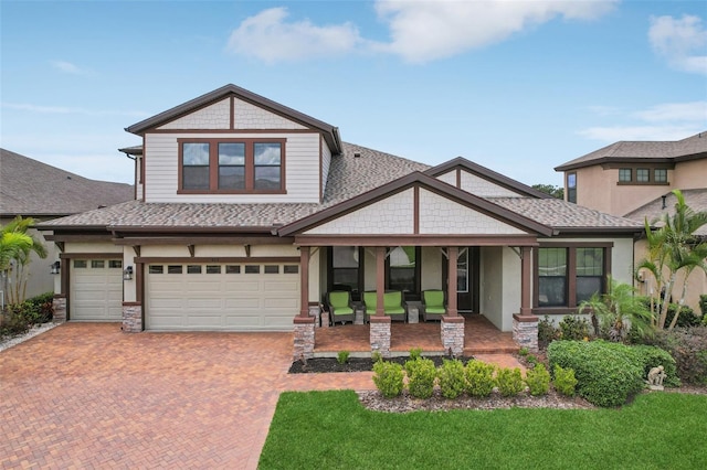 808 Vittorio Pl, Brandon, FL 33511 - craftsman house featuring a porch, decorative driveway, a front yard, and a garage