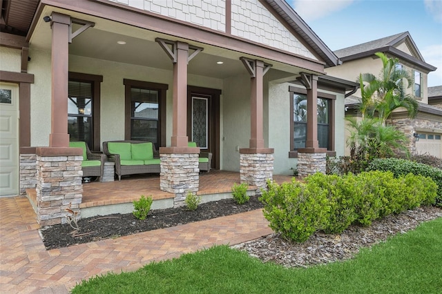808 Vittorio Pl, Brandon, FL 33511 - property entrance with a porch, stone siding, and stucco siding