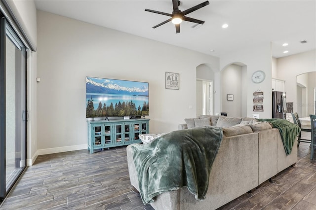 808 Vittorio Pl, Brandon, FL 33511 - living room with arched walkways, a ceiling fan, dark wood-type flooring, baseboards, and recessed lighting