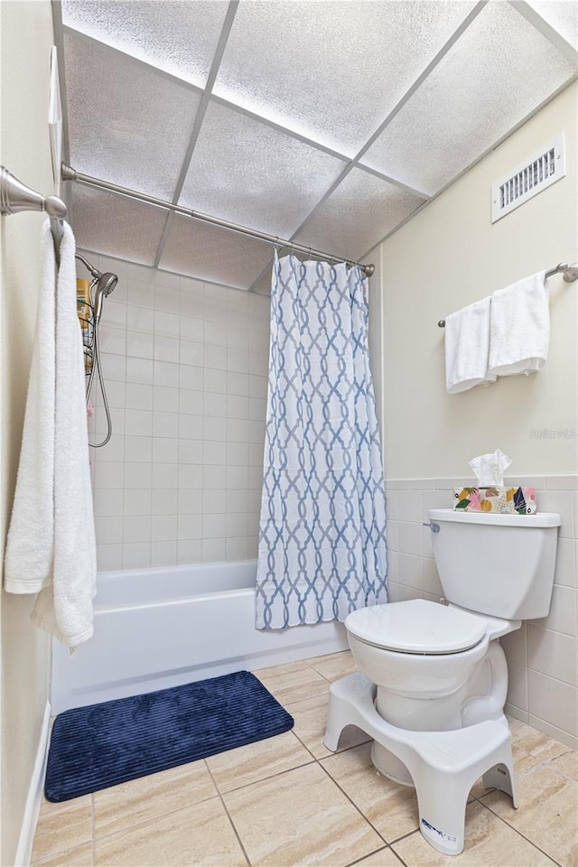 19029 US Highway 19 N Unit 3-1, Clearwater, FL 33764 - full bath with toilet, shower / tub combo, a paneled ceiling, and tile patterned flooring