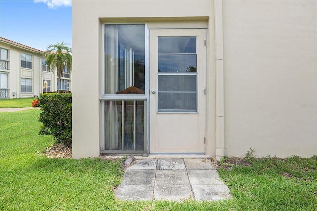 19029 US Highway 19 N Unit 3-1, Clearwater, FL 33764 - property entrance with a yard and stucco siding