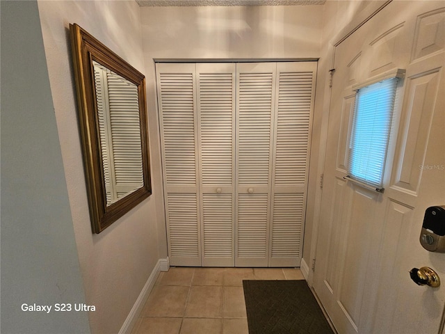 2221 Norwegian Dr Unit 15, Clearwater, FL 33763 - entryway featuring light tile patterned floors and baseboards