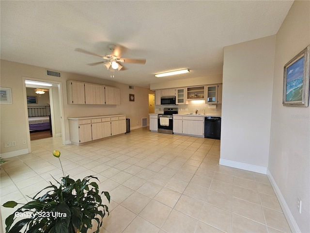 2221 Norwegian Dr Unit 15, Clearwater, FL 33763 - kitchen with black appliances, light countertops, a ceiling fan, and light brown cabinets