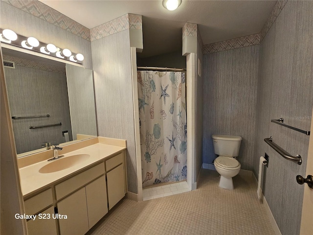 2221 Norwegian Dr Unit 15, Clearwater, FL 33763 - full bathroom with tile patterned flooring, toilet, vanity, and a stall shower
