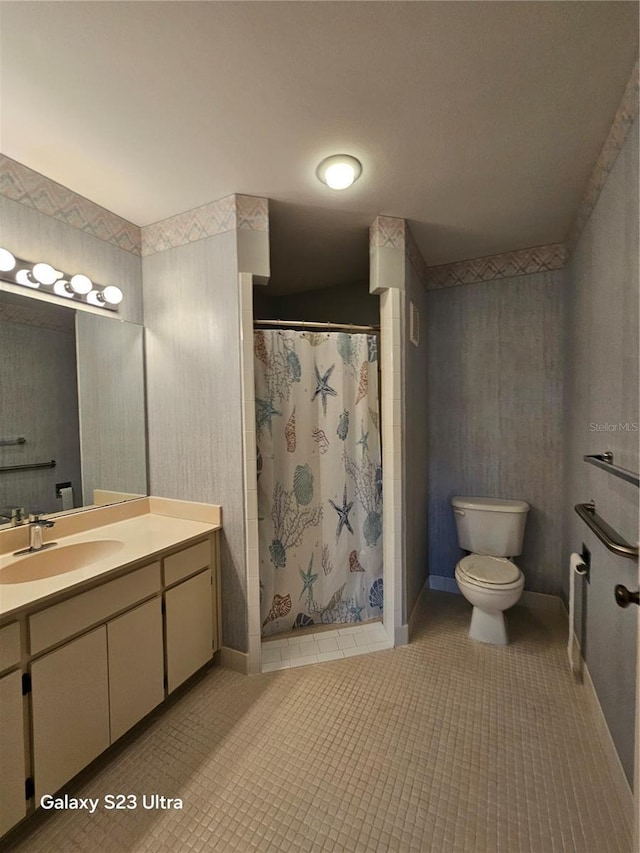 2221 Norwegian Dr Unit 15, Clearwater, FL 33763 - full bath featuring toilet, vanity, a shower stall, tile patterned flooring, and baseboards