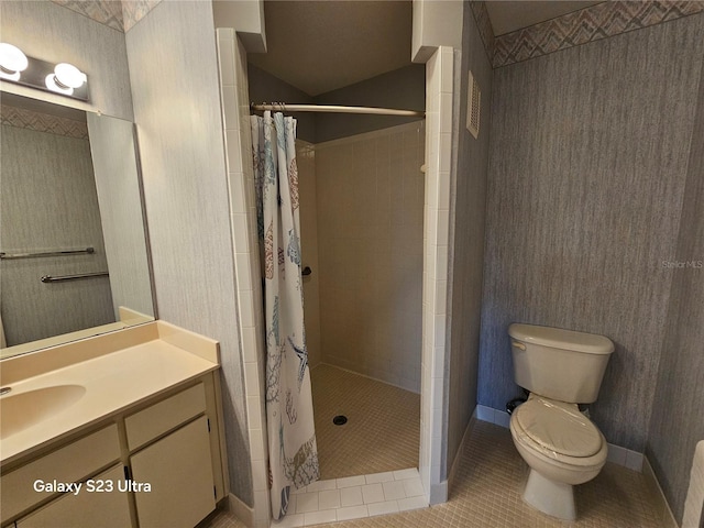 2221 Norwegian Dr Unit 15, Clearwater, FL 33763 - full bathroom featuring toilet, tile patterned flooring, vanity, and tiled shower