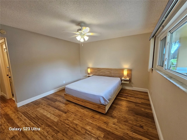 2221 Norwegian Dr Unit 15, Clearwater, FL 33763 - bedroom with baseboards, wood finished floors, a textured ceiling, and ceiling fan