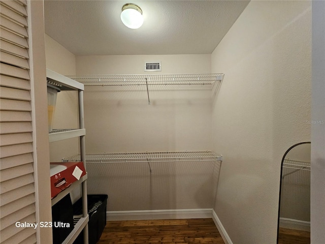 2221 Norwegian Dr Unit 15, Clearwater, FL 33763 - walk in closet featuring wood finished floors