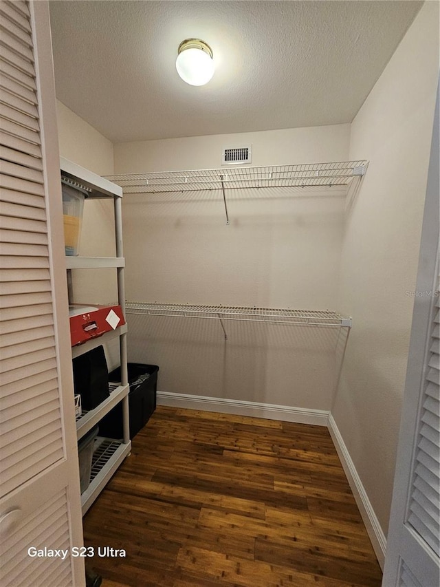 2221 Norwegian Dr Unit 15, Clearwater, FL 33763 - spacious closet featuring wood finished floors