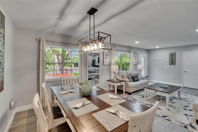 8222 Valrie Ln, Riverview, FL 33569 - dining room featuring baseboards, wood finished floors, and recessed lighting