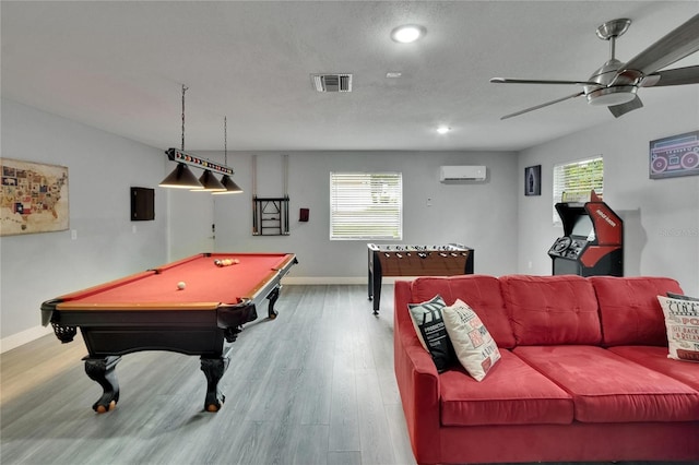 8222 Valrie Ln, Riverview, FL 33569 - playroom with a wall unit AC, ceiling fan, wood finished floors, healthy amount of natural light, and recessed lighting