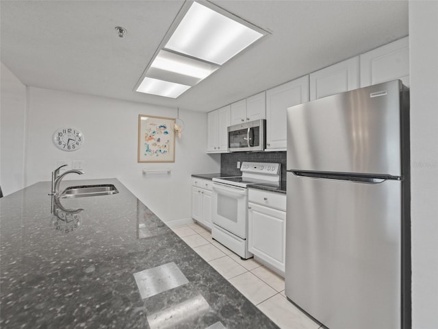 18610 Gulf Blvd Unit 208, Indian Shores, FL 33785 - kitchen with stainless steel appliances, a sink, and white cabinetry