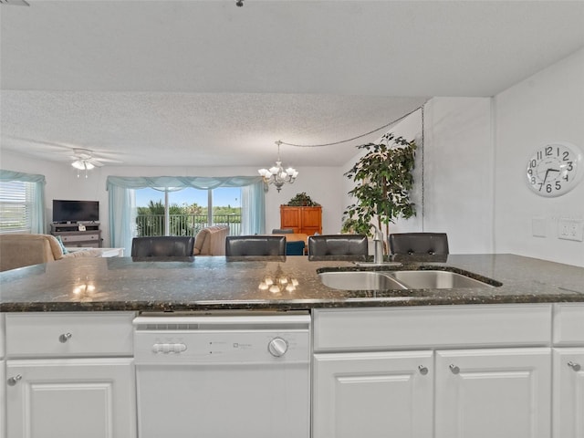 18610 Gulf Blvd Unit 208, Indian Shores, FL 33785 - kitchen with dishwasher, a sink, a chandelier, white cabinets, and a textured ceiling