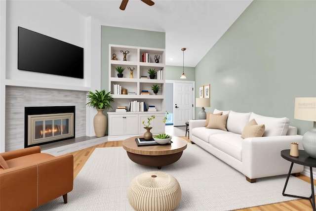 2640 Enterprise Rd E Unit B25, Clearwater, FL 33759 - living area featuring wood finished floors, ceiling fan, and a premium fireplace